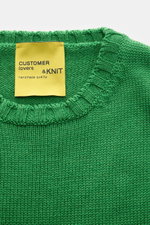 Close-up top-down view of the B.F. Knitwear Merino crew neck jumper green, made of pure merino wool with a soft feel, semi chunky knit, slim fit, crew neck, and rib knit bands.