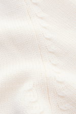 Close-up image of the off-white B.F. Knitwear Merino crew neck jumper, photographed from above, showing pure merino wool, soft feel, semi chunky knit, slim fit, crew neck, and rib knit bands.