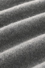Close-up front view of B.F. Knitwear Cashmere crew neck sweater grey melange showing soft touch, medium-fine knit pattern, and texture.