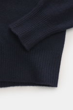 Close-up front view of B.F. Knitwear Cashmere crew neck sweater navy showing elastic ribbed cuffs and medium-fine knit in pure cashmere.

Description: <p>Autumnal cashmere from the knitting expert B.F. KNITWEAR: This softly knitted crew neck sweater is th