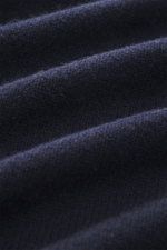 Close-up front view of B.F. Knitwear Cashmere crew neck sweater navy showing soft, pure cashmere medium-fine knit, elastic ribbed cuffs.