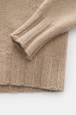 Close-up front view of B.F. Knitwear Cashmere crew neck sweater beige showing elastic ribbed cuffs, medium coarse knit, and soft texture.