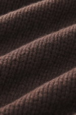 Close-up, detailed view of the medium coarse knit pattern and soft texture of the B.F. Knitwear Cashmere crew neck sweater dark brown, photographed from a top-down perspective.

Description: <p>Autumnal cashmere from the knitting expert B.F. KNITWEAR: Thi