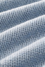 Close-up front view of B.F. Knitwear Cashmere crew neck sweater light blue melange showing soft, medium coarse knit texture.
