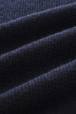 Close-up side view of the navy B.F. Knitwear Cashmere crewneck sweater showcasing its pure cashmere, medium knit texture, and soft touch.