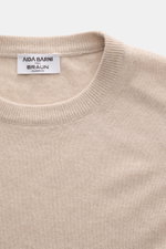 Close-up front view of Aida Barni Cashmere crew neck jumper sand melange showcasing pure cashmere, fine knit, ribbed crew neckline, and soft texture.