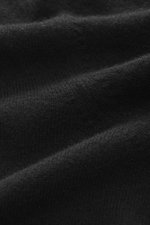 Close-up, angled view of the fine knit pattern and soft texture of the Aida Barni Cashmere crew neck jumper black fabric.

Additional description:  
<p>Luxury-class essential: The Italian label AIDA BARNI processes premium cashmere in this timeless crewne