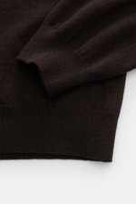 Close-up front view of Aida Barni Cashmere crew neck jumper dark brown sleeve and ribbed cuff, showing fine knit and soft texture.  

Description: <p>Luxury-class essential: The Italian label AIDA BARNI processes premium cashmere in this timeless crewneck
