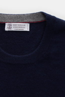 Close-up top-down view of Brunello Cucinelli Cashmere pullover navy crew neck sweater showing pure cashmere knit, fine texture, and narrow contrast edges.
