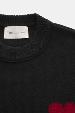 Ami Paris Crew neck jumper black shown from a close-up top-down perspective, highlighting ribbed crew neck and fabric texture.  
<p>Stylish basic: This crew neck jumper with a casual cut and an XXL logo intarsia made from pure virgin wool is an enduring c