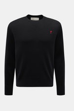 Ami Paris Merino Crew Neck Sweater Black shown from the front, made of pure merino wool with soft touch, fine knit pattern, regular fit, crew neckline, logo stitching on chest, and ribbed cuffs. 

<p>Timeless basic: The AMI PARIS crew neck sweater made fr