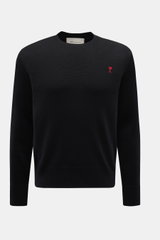 Ami Paris Merino Crew Neck Sweater Black shown from the front, made of pure merino wool with soft touch, fine knit pattern, regular fit, crew neckline, logo stitching on chest, and ribbed cuffs. 

<p>Timeless basic: The AMI PARIS crew neck sweater made fr