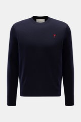 Front view of the Ami Paris Merino Crewneck Sweater Navy, made of pure merino wool with soft touch, fine knit, regular fit, crew neckline, red logo stitching on chest, and ribbed cuffs. 

<p>Timeless basic: The AMI PARIS crewneck sweater made of pure meri