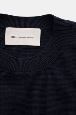 Close-up front view of Ami Paris Merino Crewneck Sweater Navy showing crew neckline, fine knit pattern, and white label inside collar. 

<p>Timeless basic: The AMI PARIS crewneck sweater made of pure merino wool is a comfortable companion for office and l