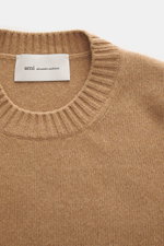 Close-up front view of Ami Paris Cashmere crewneck sweater light brown showing ribbed crew neckline and knit texture.

Description: <p>Elegant essential from AMI PARIS: With this classic crewneck sweater made of luxurious cashmere blended with wool, you w