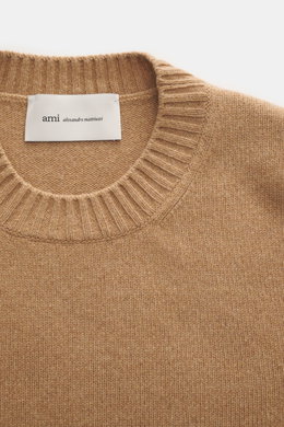Close-up front view of Ami Paris Cashmere crewneck sweater light brown showing ribbed crew neckline and knit texture.

Description: <p>Elegant essential from AMI PARIS: With this classic crewneck sweater made of luxurious cashmere blended with wool, you w