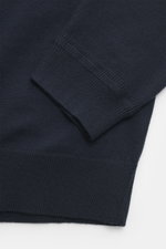 Close-up view of the sleeve and hem of the navy Maison Kitsuné Crewneck Sweater 'Red Profile' showing fine knit pattern, soft pure wool knit, and ribbed cuffs.

Description: <p>Cool essential by MAISON KITSUNÉ: With the typical fox stitching on the chest,