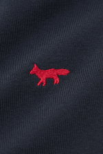 Close-up front view of navy knit Maison Kitsuné Crewneck Sweater 'Red Profile' navy showing red fox stitching on soft, fine pure wool knit.