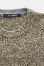 Close-up front view of Jacquemus Merino crew neck sweater multicolor showing elastic merino wool, soft touch, medium-fine knit pattern, regular fit, crew neckline, logo detail on the back, and comfortable ribbed cuffs.