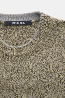 Close-up front view of Jacquemus Merino crew neck sweater multicolor showing elastic merino wool, soft touch, medium-fine knit pattern, regular fit, crew neckline, logo detail on the back, and comfortable ribbed cuffs.
