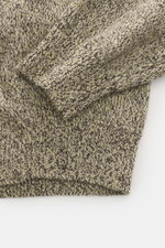 Close-up top-down view of Jacquemus Merino crew neck sweater multicolor showing elastic merino wool, soft touch, medium-fine knit pattern, regular fit, crew neckline, logo detail on back, and comfortable ribbed cuffs.