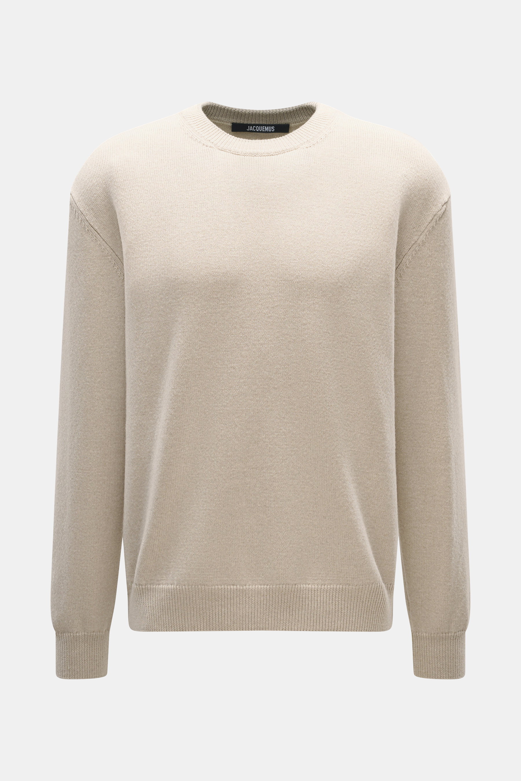 Front view of Jacquemus Merino crew neck sweater beige melange, made of elastic merino wool with soft touch, medium-fine knit pattern, regular fit, crew neckline, logo detail on the back, and comfortable ribbed cuffs.