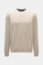 Front view of Jacquemus Merino crew neck sweater beige melange, made of elastic merino wool with soft touch, medium-fine knit pattern, regular fit, crew neckline, logo detail on the back, and comfortable ribbed cuffs.
