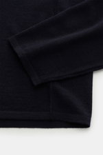 Close-up top-down view of the sleeve and hem of the Kiefermann Merino Crewneck Sweater "Marleys" navy, a slim fit pure Merino wool sweater with soft touch, very fine knit pattern, and crew neckline, perfect as a luxurious basic layering piece on cold days