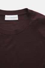 Close-up top view of the burgundy Kiefermann Merino Crewneck Sweater 'Marleys' showing the crew neckline, fine knit pattern, and label, a luxurious basic piece made of pure Merino wool with a soft touch and slim fit, perfect for layering on cold days.