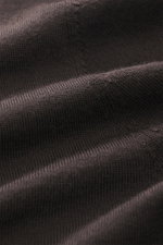 Close-up image of dark brown fabric showcasing the very fine knit pattern of the Kiefermann Merino Crewneck Sweater 'Marleys' from a front perspective. Luxurious Basic Piece: The crewneck sweater from KIEFERMANN impresses with its timeless fine-knit desig