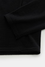 Close-up view of the sleeve and hem of the Kiefermann Merino Fine Knit Sweater 'Benjaminn' black, showing pure merino wool, super soft feel, very fine knit pattern, slim fit, round neckline, and open, rolled edge finishes.
