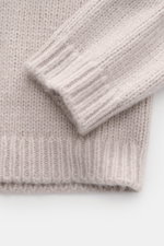 Close-up top-down view of the Iris von Arnim Cashmere-silk crew neck sweater 'Felton' sand, showing a slim fit with a voluminous knit pattern, comfortable ribbed cuffs, crew neckline, and very soft feel from a mix of cashmere and silk.