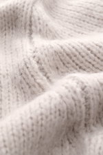 Iris von Arnim Cashmere-silk crew neck sweater 'Felton' sand shown in close-up from above, highlighting voluminous knit pattern, soft texture, slim fit, crew neckline, and ribbed cuffs. Mix of cashmere and silk, very soft feel.