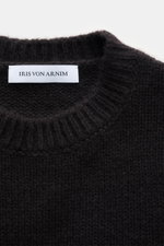 Close-up top-down view of Iris von Arnim Cashmere-silk crew neck sweater 'Felton' dark brown, showing voluminous knit pattern, slim fit, crew neckline, comfortable ribbed cuffs, very soft feel, and mix of cashmere and silk.