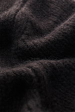 Close-up front view of Iris von Arnim Cashmere-silk crew neck sweater 'Felton' dark brown showing voluminous knit pattern, mix of cashmere and silk, very soft feel, slim fit, crew neckline, and comfortable ribbed cuffs.