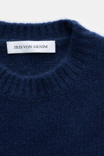 Close-up front view of Iris von Arnim Cashmere-silk crew neck sweater 'Felton' dark blue, showing mix of cashmere and silk, very soft feel, voluminous knit pattern, slim fit, crew neckline, and comfortable ribbed cuffs.