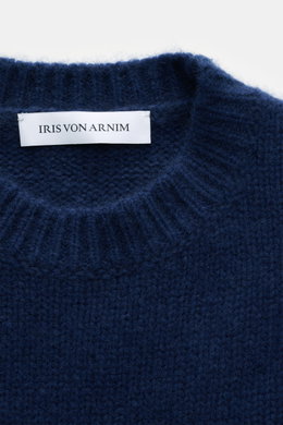 Close-up front view of Iris von Arnim Cashmere-silk crew neck sweater 'Felton' dark blue, showing mix of cashmere and silk, very soft feel, voluminous knit pattern, slim fit, crew neckline, and comfortable ribbed cuffs.