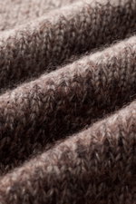 Close-up macro shot of the Iris von Arnim Crewneck Sweater 'Felton' taupe/dark brown melange, showing its coarse knit texture and soft silk-cashmere blend. Exclusive knitwear from Hamburg with a very soft feel, regular fit, crew neckline, and comfortable 