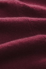 Close-up front view of the Bordeaux-colored FTC Cashmere Crew Neck Sweater showing pure cashmere fine knit texture and soft touch.