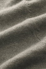 Close-up view of the fine knit pattern and soft texture of the grey green FTC Cashmere Crew Neck Sweater, showing pure cashmere fabric.