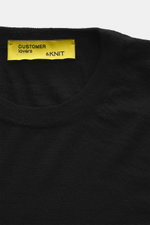 Close-up front view of the B.F. Knitwear Merino Crew Neck Sweater black showing crew neckline, pure merino wool, soft feel, fine knit pattern, regular fit, and comfortable ribbed cuffs.