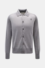 Front view of Ami Paris Merino cardigan grey mottled with knit collar, six-button placket, raglan sleeves, and logo stitching on chest.

<p>Timelessly elegant: The AMI PARIS cardigan, with its knit turn-down collar and pure merino wool fabric, is a comfor