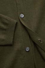 Close-up front view of the von Braun Cashmere knit shirt dark olive showing fine knit texture, button placket, and ribbed cuff.

<p>Luxurious winter essential: This VON BRAUN knit shirt in the finest Mongolian cashmere has a timeless design that offers 