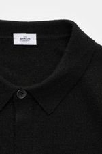 Close-up front view of von Braun Cashmere knit shirt black showing the classic turn-down collar and smooth button placket in fine knit.

Description: 
<p>Luxurious winter essential: This VON BRAUN knit shirt in the finest Mongolian cashmere has a timeless