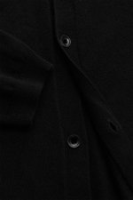 Close-up front view of von Braun Cashmere knit shirt black showing fine knit texture, smooth button placket, ribbed cuffs, and buttons.

<p>Luxurious winter essential: This VON BRAUN knit shirt in the finest Mongolian cashmere has a timeless design that o