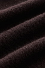 Close-up front-angle view of dark brown fine knit fabric of the von Braun Cashmere half-zip jumper dark brown showing its soft texture and ribbed bands.

<p>This clean VON BRAUN half-zip jumper made from high-quality and exceptionally fine Mongolian cashm