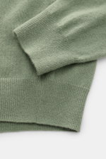Close-up front view of the von Braun Cashmere half-zip jumper sage showing fine knit, ribbed bands, and soft cashmere fabric.

<p>This clean VON BRAUN half-zip jumper made from high-quality and exceptionally fine Mongolian cashmere combines a timeless des