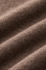 Close-up front view of the fine knit fabric texture of the von Braun Cashmere half-zip jumper brown mottled, showcasing its soft, pure cashmere material.

<p>This clean VON BRAUN half-zip jumper made from high-quality and exceptionally fine Mongolian cash