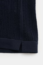 Close-up front view of the textured knit hem with short vents on the navy 04651/ A trip in a bag Short sleeve knit shirt narrow collar navy.

<p>Summery ease: With a casual cut and comfortable cotton, this short sleeve knit shirt by 04651/ A TRIP IN A BAG