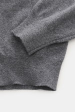 Gran Sasso Cashmere half-zip jumper dark grey melange shown from a close-up top-down view, highlighting elastic rib cuffs, fine knit, and soft cashmere texture.